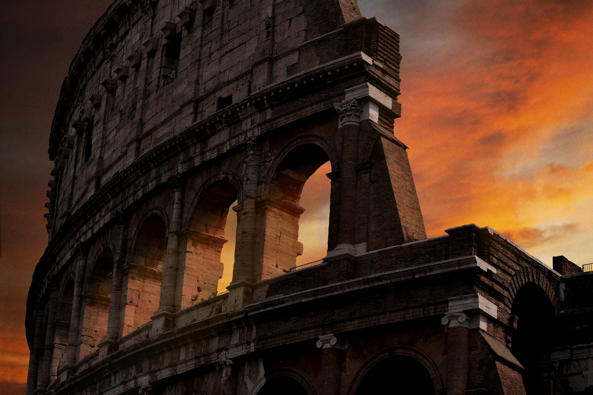 The Colosseum illuminated by a golden Roman sunset